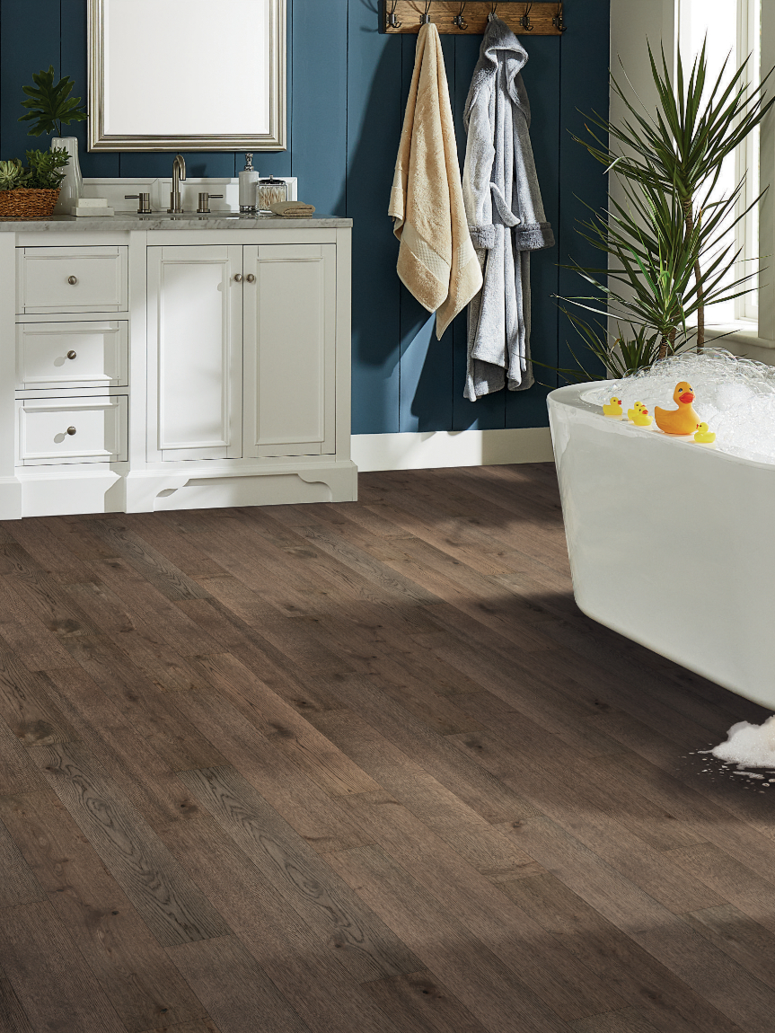 Hard surface flooring with overflowing bath tub